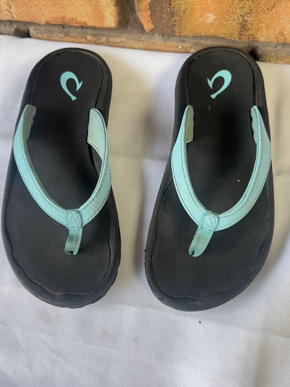 OluKai Kids Black Flip-Flops with Aqua Straps